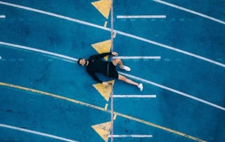 temperance and tapering - an exhausted runner collapses on the track